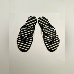 Havaianas Logo Metallic Stripes Slim Flip Flop in Black/White/Gold Stripes